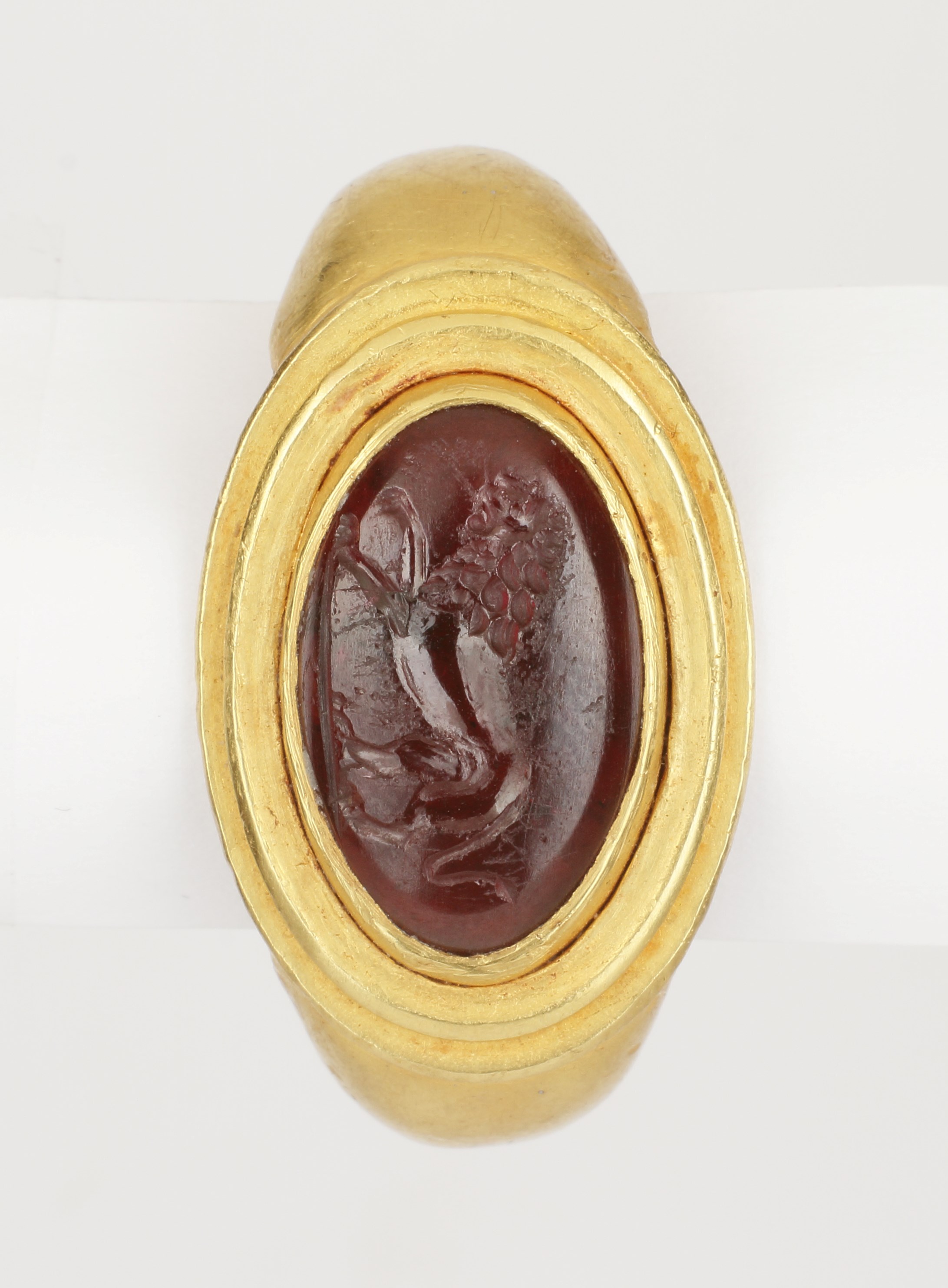 A Fine Greek Finger Ring Set with a Garnet Intaglio of a Lion